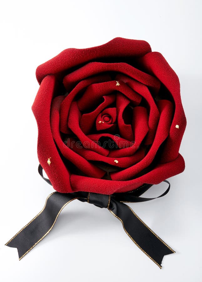 Closeup of rose flower shaped cake over white background