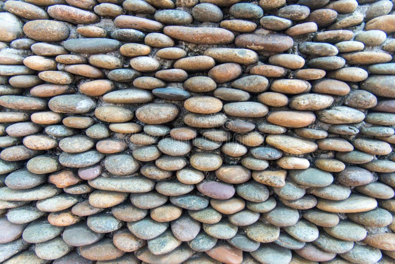 Closeup Rounded stone are arranged in layers abstract texture background stock images