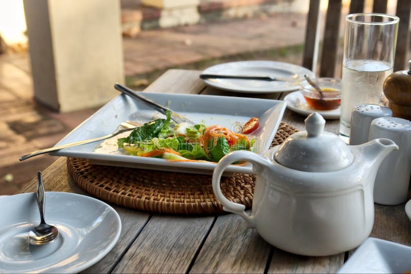 Closeup of Salad Dish N Tea Pot in Restaurant Stock Image Image of
