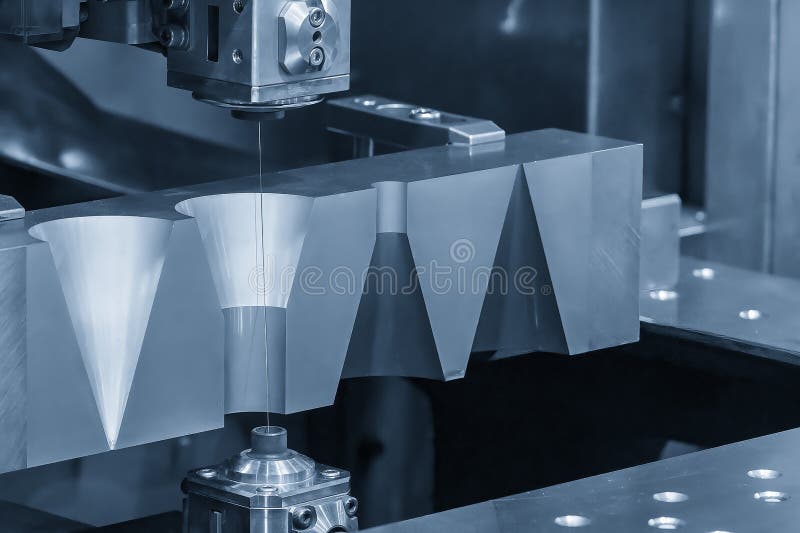 Closeup Scene the Wire EDM Machine Cutting the Mold Insert Parts Stock