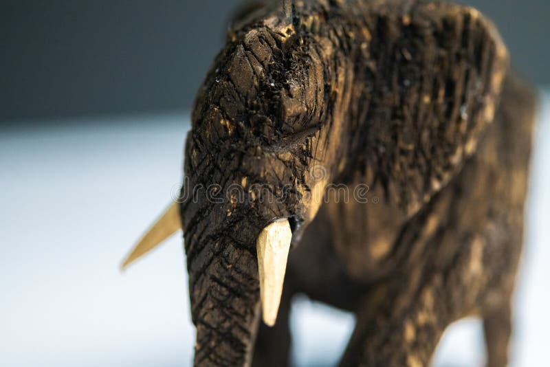 Closeup selective focus shot of a small wooden sculpture of a mammoth. A closeup selective focus shot of a small wooden sculpture of a mammoth royalty free stock photo Closeup selective focus shot of a small wooden sculpture of a mammoth. A closeup selective focus shot of a small wooden sculpture of a mammoth royalty free stock photo