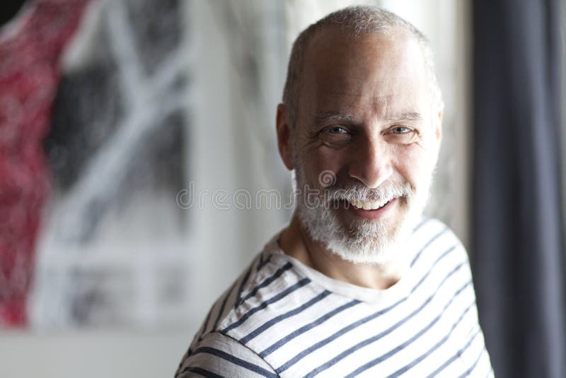 Closeup Of A Senior Man Smiling At The Camera royalty free stock photo Closeup Of A Senior Man Smiling At The Camera royalty free stock photo