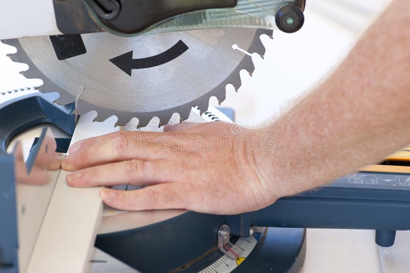 Safety at workplace with circular saw and hand stock images Safety at workplace with circular saw and hand stock images