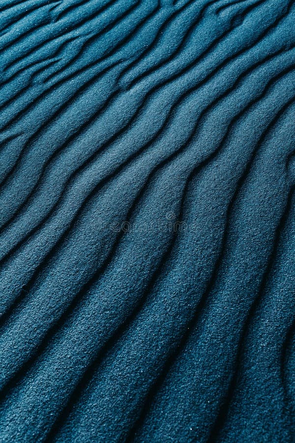 Closeup Shot of a Blue Colored Sand Dunes on a Beach Stock Image