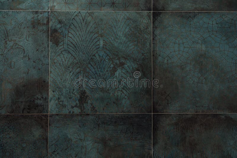 Closeup Shot of Dark Blue Patterned Tiles of a Bathroom Wall for