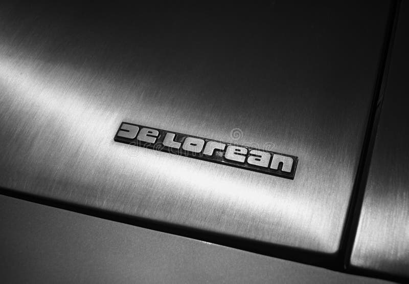 Closeup shot of the DMC Delorean logo on a stainless steel surface