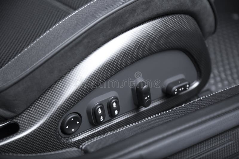 Closeup Shot of a Door Handle with Power Windows Control Buttons of a Luxury Passenger Car Stock