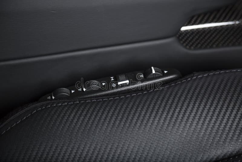 Closeup Shot of a Door Handle with Power Windows Control Buttons of a Luxury Passenger Car Stock