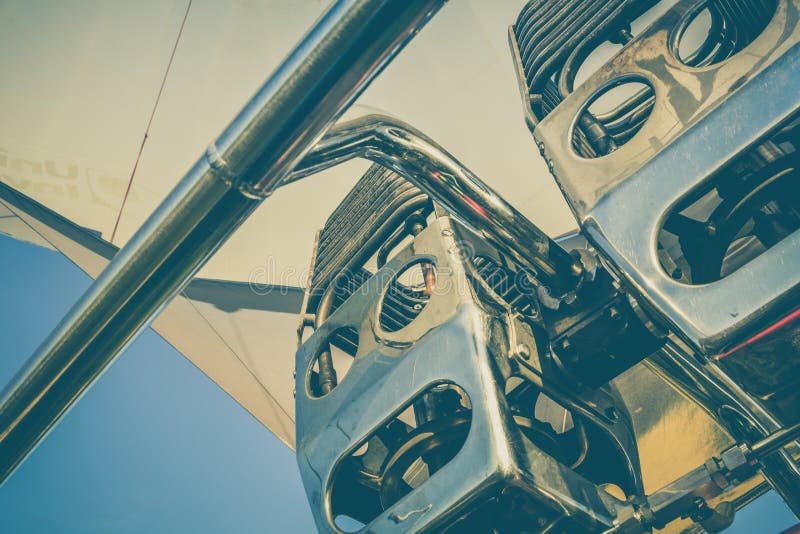 Closeup shot of hot air balloon engine under the beautiful blue sky royalty free stock photography Closeup shot of hot air balloon engine under the beautiful blue sky royalty free stock photography