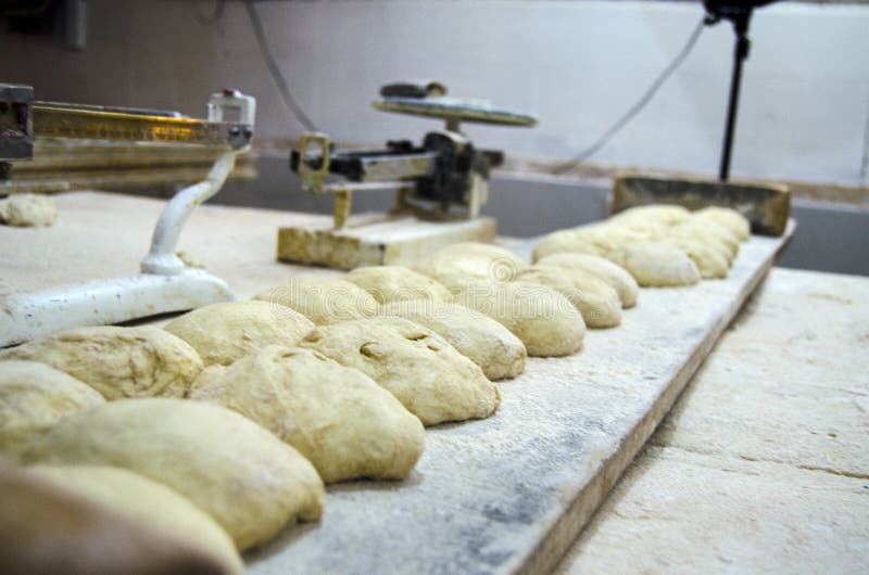 Unbaked Bread Dough on the Table. Sourdough Bread Buns Ready To Be