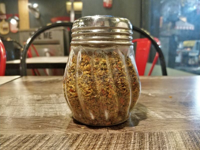 Closeup Shot of Oregano and Chilli Flakes on Table Stock Image Image