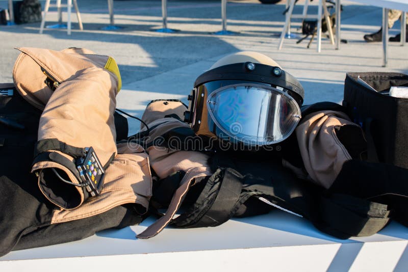 A closeup shot of a protective gear for defusing bombs or a blast suit on a bench