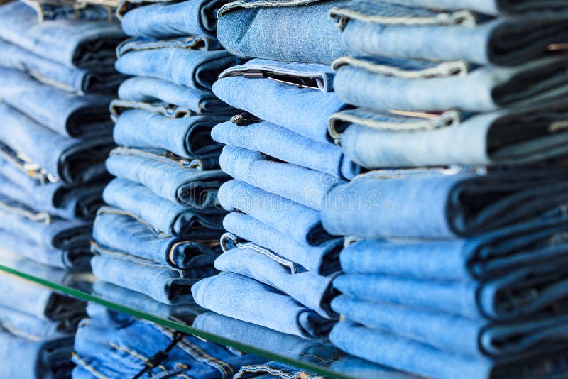 Closeup shot of stack of folded jeans royalty free stock photography
