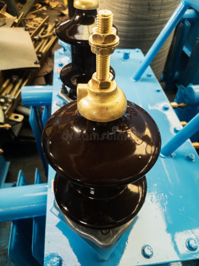 Closeup shot of transformer bushings having shell type porcelain insulator.