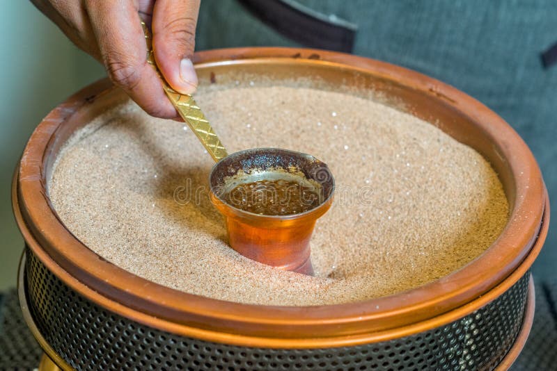 Closeup Shot of a Turkish Coffee Sand Machine with a Jar Stock Photo