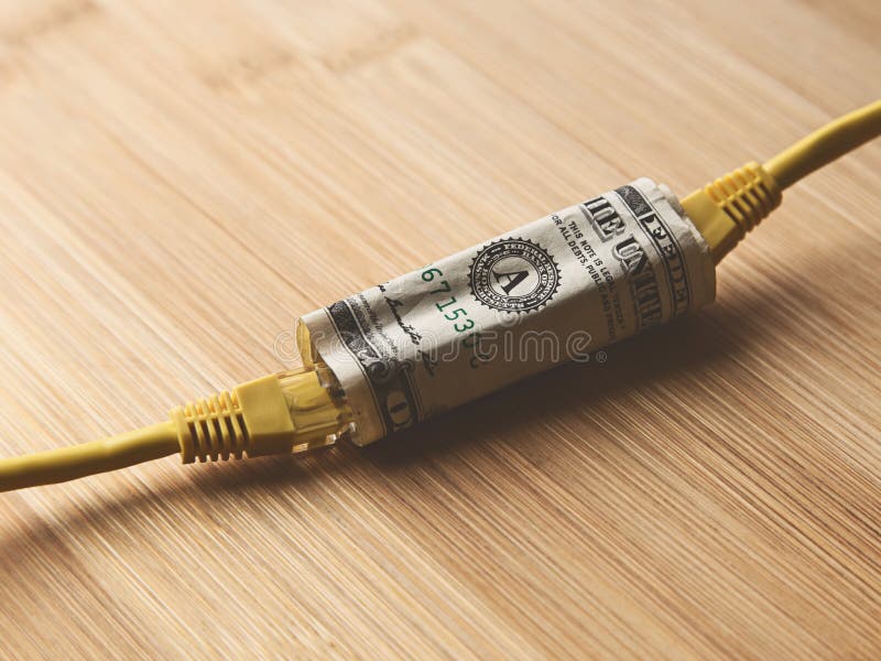 Closeup Shot Of Two Yellow Cables Going Through A Dollar Bill