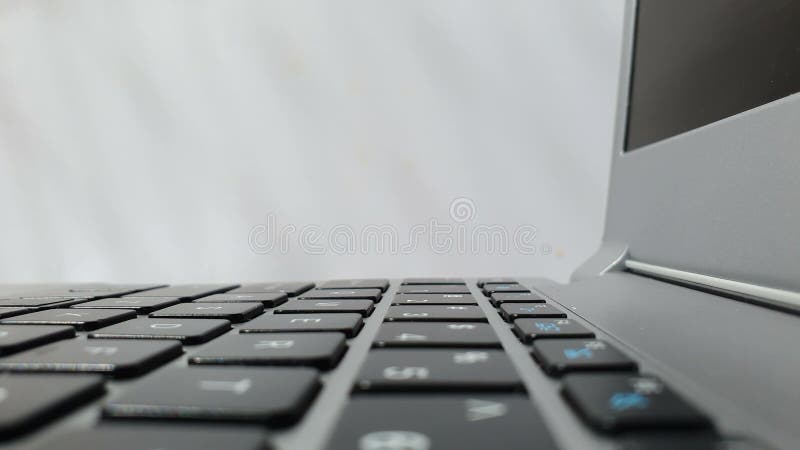 Closeup of side view of a modern laptop keyboard. Business, internet technology, social network concept stock video footage