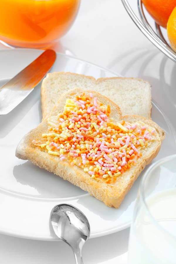 Closeup of a slice of bread with candies stock images