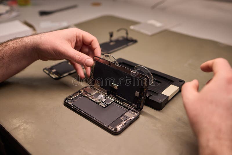 Expert Smartphone Repair Using Advanced Precision Tools for Optimal Performance and Quality stock image