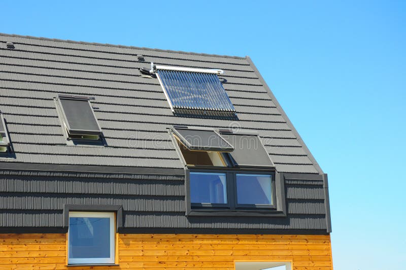 Closeup of Solar Water Panel Heating, Dormers, Solar Panels, Skylights. Passive House Building Concept. Closeup of Solar Water Panel Heating, Dormers, Solar royalty free stock photo Closeup of Solar Water Panel Heating, Dormers, Solar Panels, Skylights. Passive House Building Concept. Closeup of Solar Water Panel Heating, Dormers, Solar royalty free stock photo