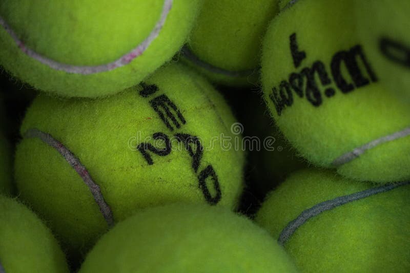 Closeup of a Stack of Green Wilson Tennis Balls Editorial Photography
