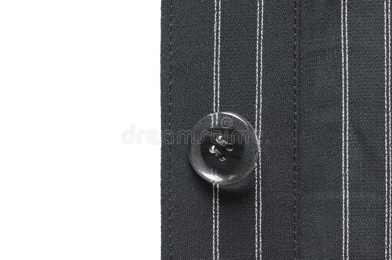 Closeup of suit button on pin stripped cloth. Button clasp stock images, royalty-free photos and pictures