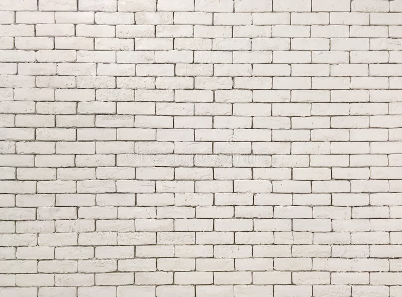 Closeup Surface Brick Pattern at Old Cream Color Stone Brick Wall