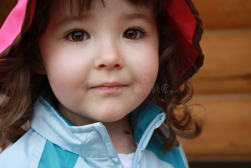 Closeup of sweet young girl with amazing brown eyes