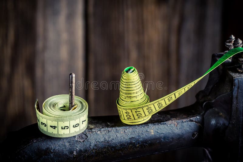 Seamstress using tape measure Stock Photo by ©tonodiaz 149437584