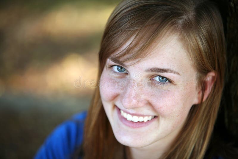 Closeup of pretty young girl with blue eyes and freckles. Closeup of pretty young girl with blue eyes and freckles