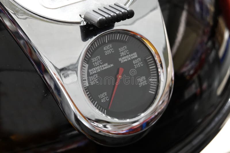 Closeup ,Temperature Gauge of BBQ Grill Displayed on the Cover. Stock