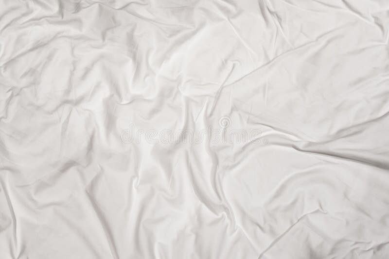 Closeup Texture of Crumpled White Bed Sheet with Messy Abstract Pattern