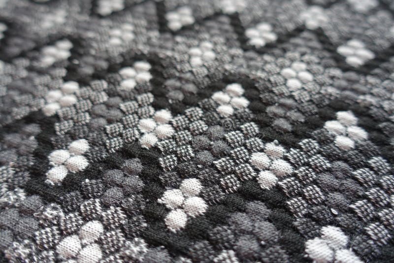 Closeup of thick grey cotton fabric with geometric pattern royalty free stock photography Closeup of thick grey cotton fabric with geometric pattern royalty free stock photography