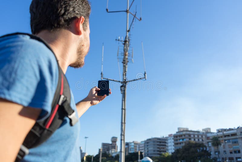 closeup Tourist With No Cellphone data Or Network. Man holding mobile telephone and searching for signal internet connection. royalty free stock image closeup Tourist With No Cellphone data Or Network. Man holding mobile telephone and searching for signal internet connection. royalty free stock image