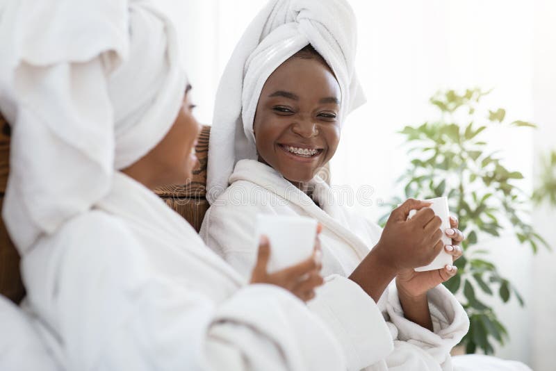 Closeup of two african women enjoying spa day