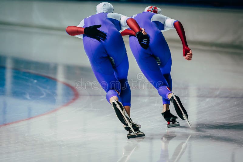 Closeup two men skaters synchronous running royalty free stock image Closeup two men skaters synchronous running royalty free stock image