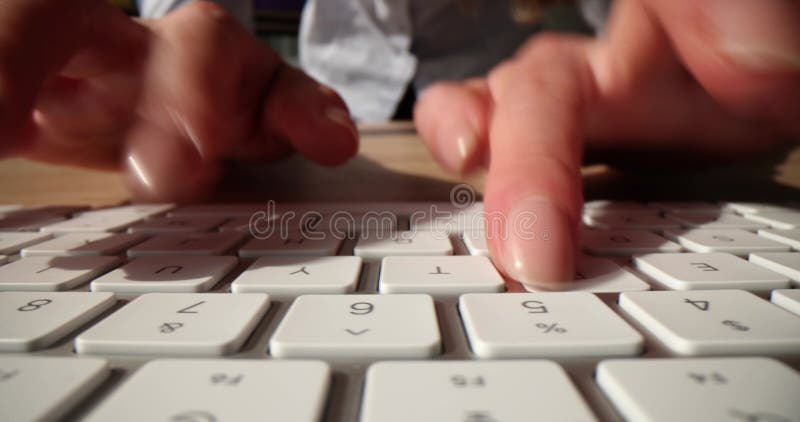 Closeup of typing on a white keyboard stock video footage