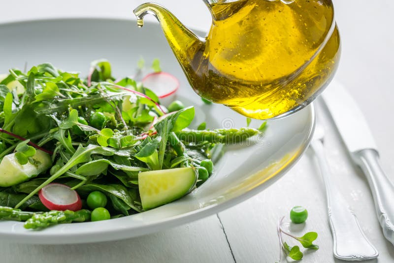 Closeup of Vegetarian Salad with Mix of Vegetables and Oil Stock Image