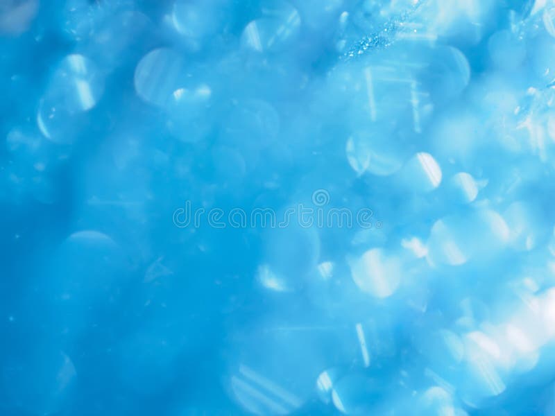 Closeup view of an abstract soft-focused glittering and shiny bokeh background.