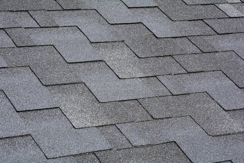 Closeup view on Asphalt Roofing Shingles Background. Roof Shingles - Roofing. royalty free stock images