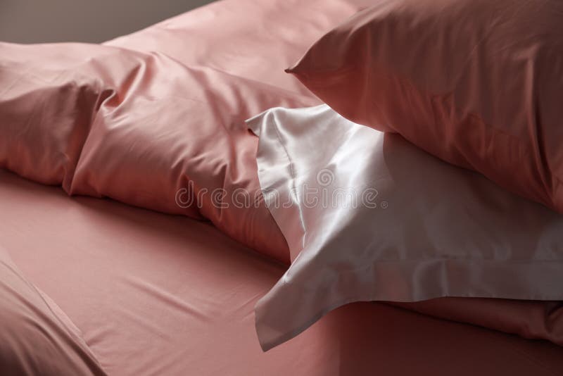 Closeup view of bed with beautiful silk linens