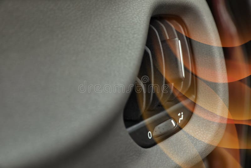 Closeup view of conditioning system in car and illustration of warm air