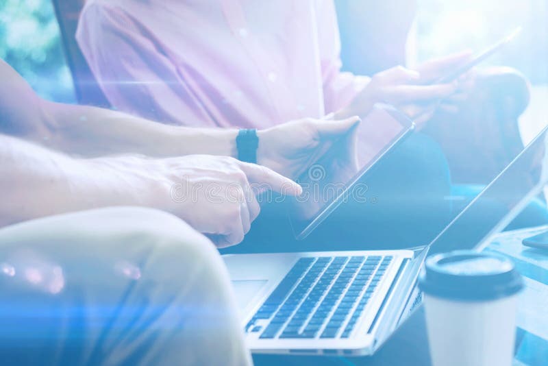 Closeup view of male hand pointing on digital tablet.Young business team working with new startup project.Laptop on the stock images Closeup view of male hand pointing on digital tablet.Young business team working with new startup project.Laptop on the stock images