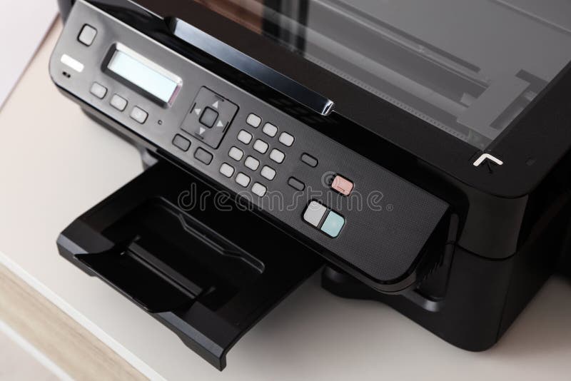 Closeup View of New Modern Printer with Control Panel on White Table