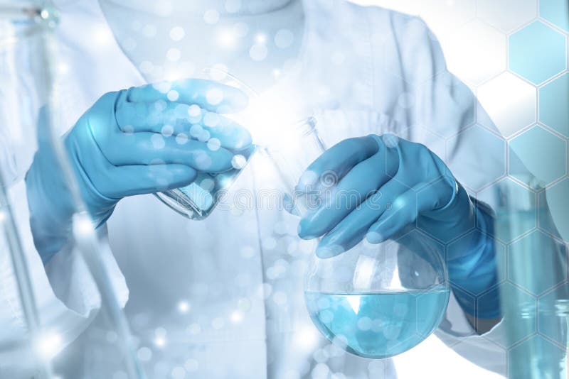 Closeup view of scientist pouring color liquid from beaker into flask, double exposure stock photography