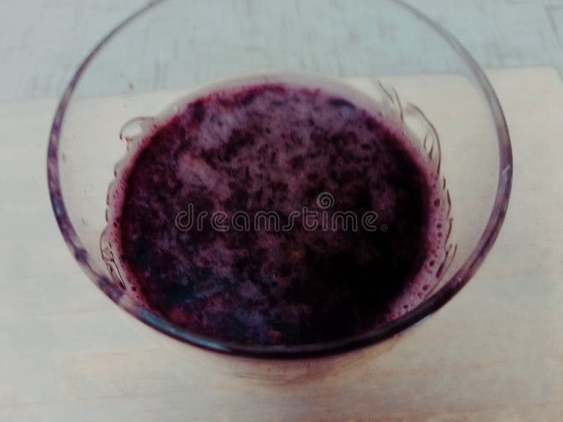 Purple liquid in a cup stock image. Image of violet 221126823