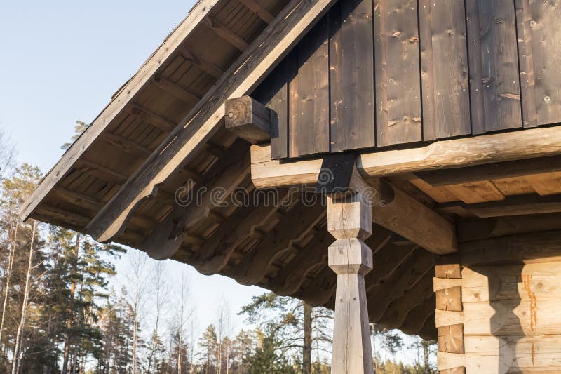 Closeup of wall frame finish with burned timber planks on log house attic and the rafters on log house roof construction royalty free stock photography Closeup of wall frame finish with burned timber planks on log house attic and the rafters on log house roof construction royalty free stock photography