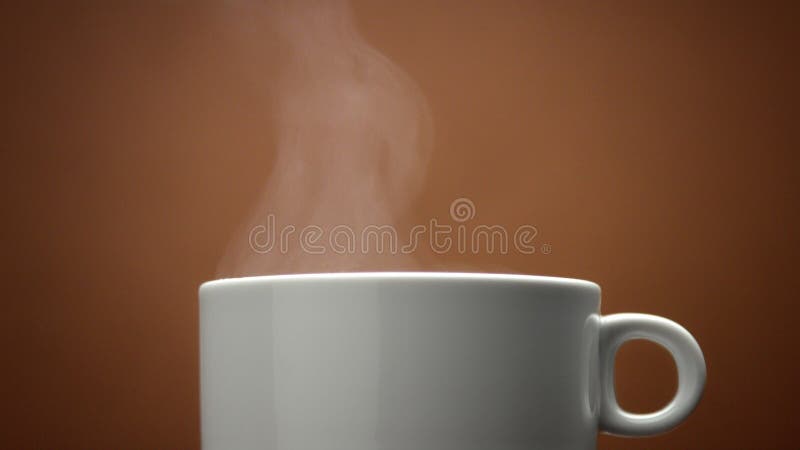 Closeup of white cup with hot drink. Steam from cup closeup. Hot coffe. loop. Hot cafe video