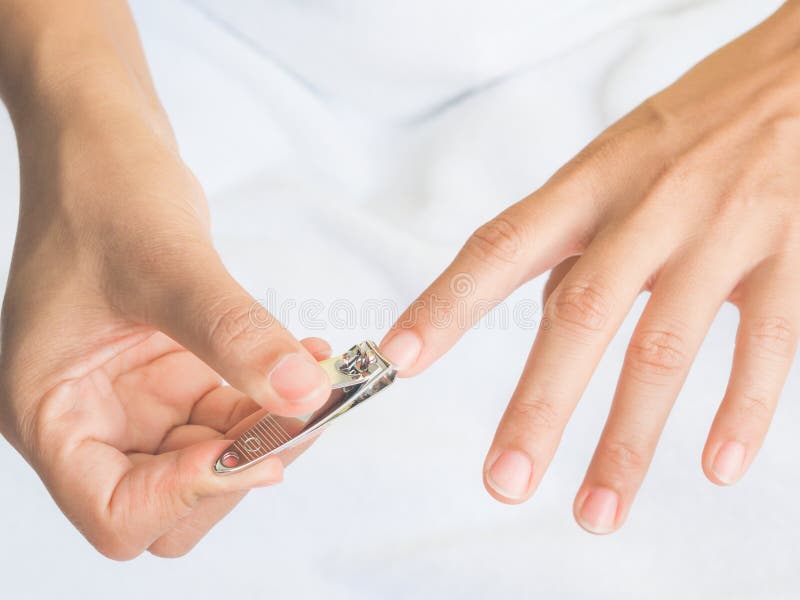 Closeup of a Woman Cutting Nails Stock Photo - Image of clipper, adult ...