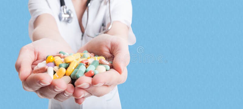 Closeup of woman doctor hands holding pills stock photos Closeup of woman doctor hands holding pills stock photos